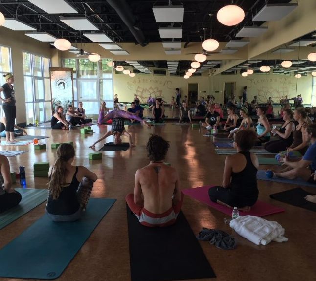 Hot yoga class at Bend & Zen in Louisville with metal heaters in the ceiling