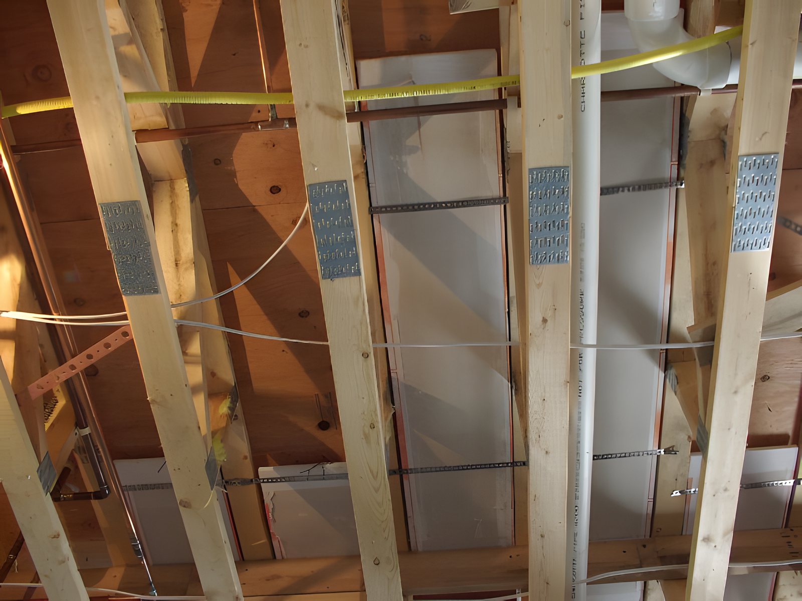 ThermaRay heating panels installed between floor joists in a home