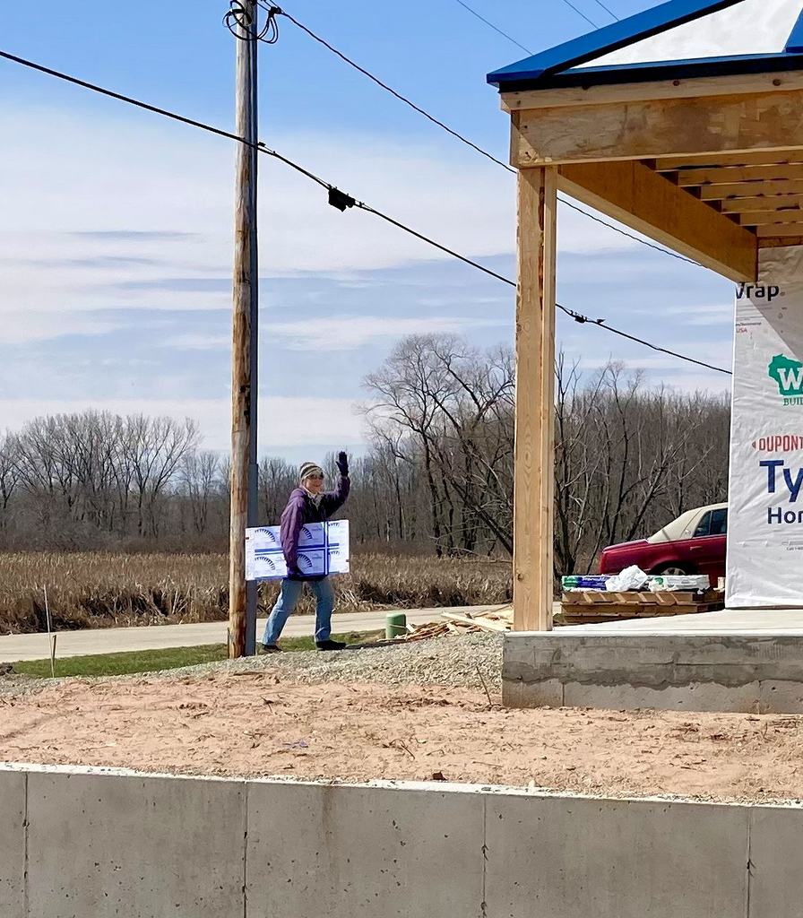 Mary Ellen Hauling Heating Panels into their new home