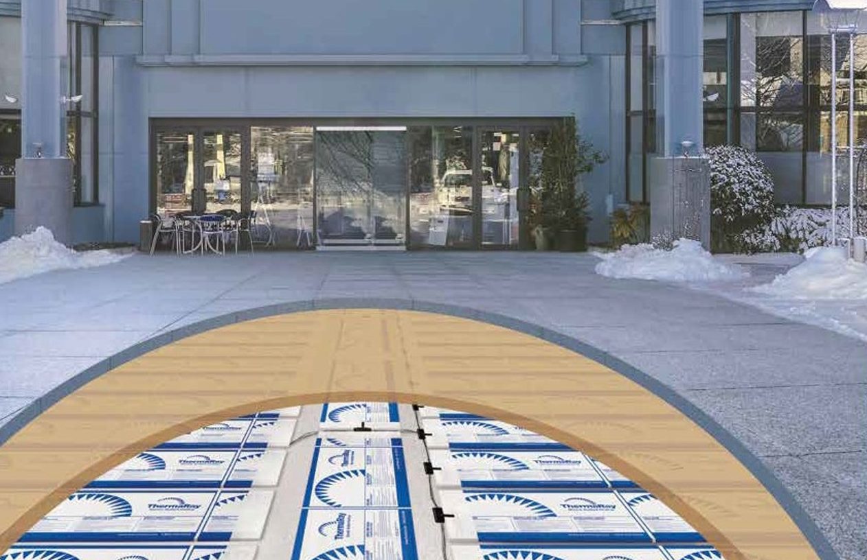Cutaway drawing of snow melt panels below a driveway surface